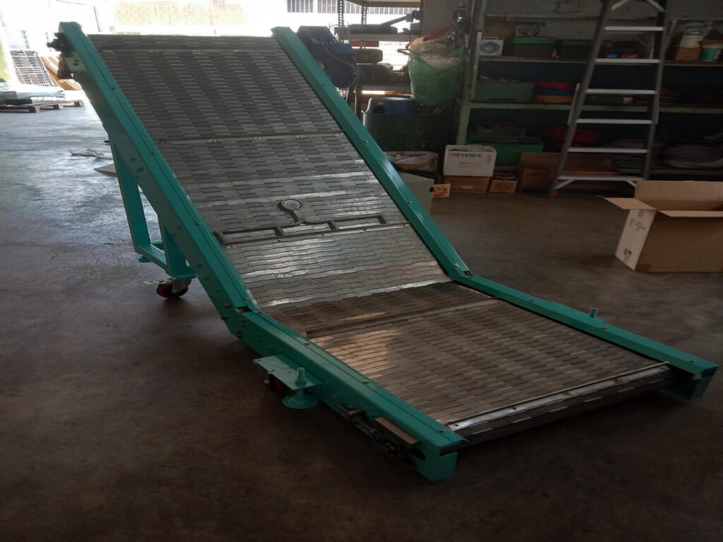 Pure Automation - Inclined Conveyor for Automotive Components Manufacturing with Industrial Automation System