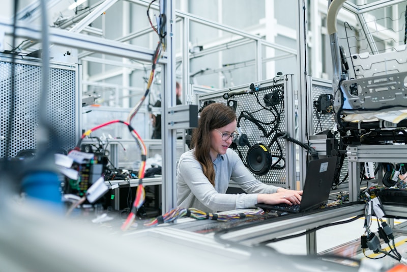 Industrial Automation Solutions - PLC engineeer working on manufacturing automation platform (Stock Image)