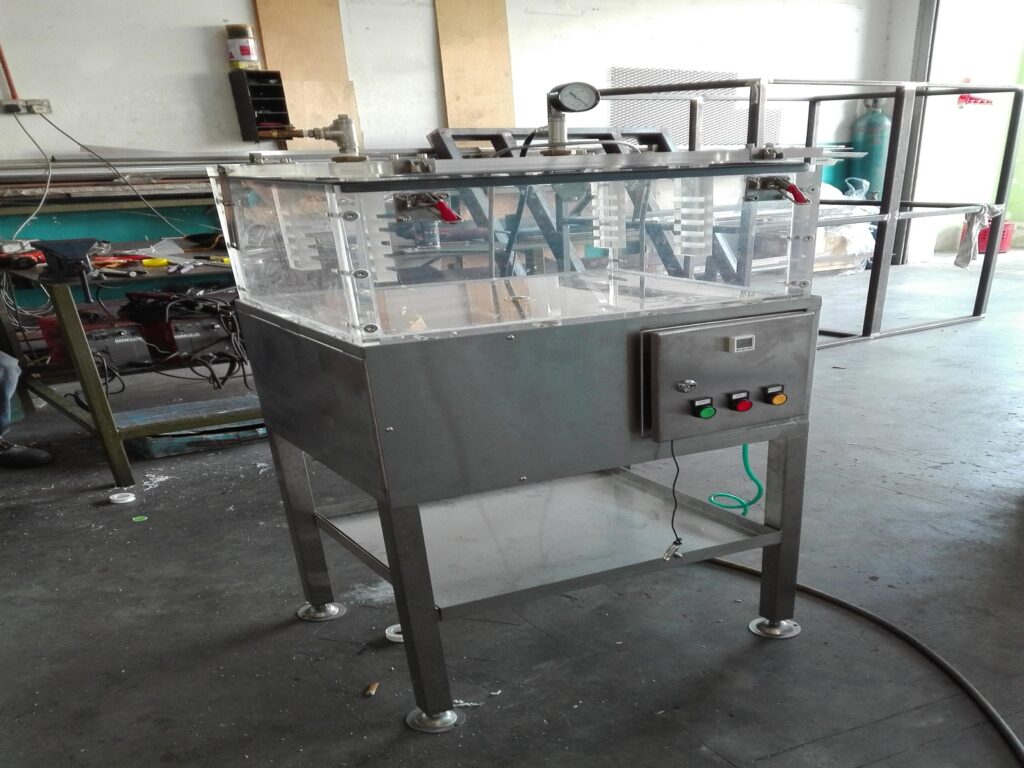 Pure Automation - An automated leak testing machine on a conveyor line, inspecting food packaging with digital sensors and status indicators.